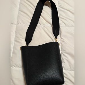 Black medium soft leather bucket handbag w/ gold trim. Style is like brand name.